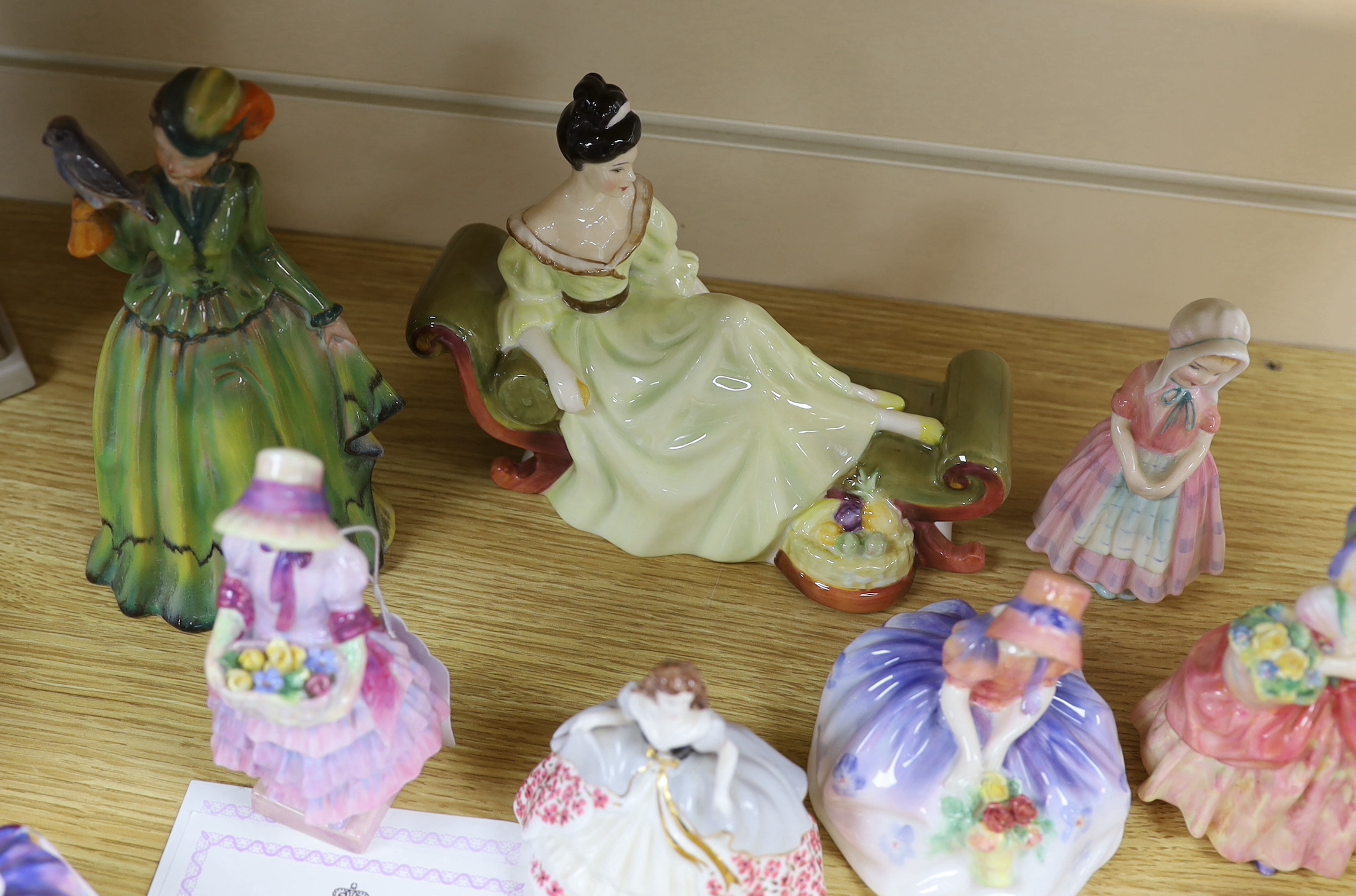 A mixed group of Royal Doulton and Coalport figures and a German figurine, the largest 20cm high